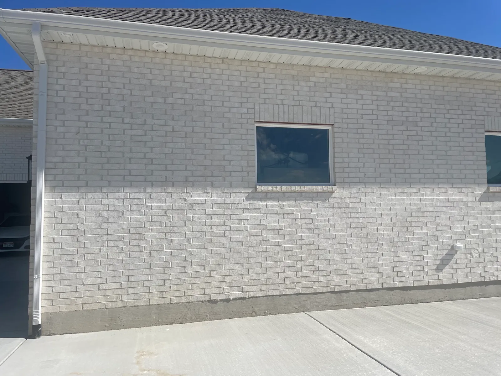 After: sleek modern dark brick transformation by N&W Enterprises