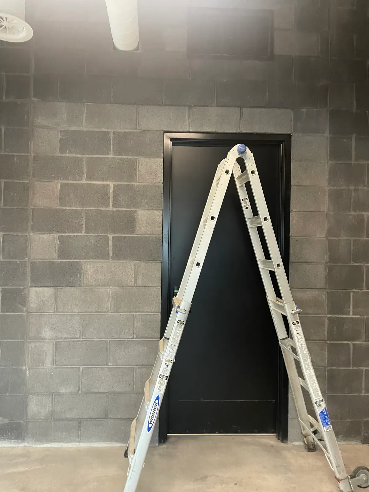 Before: faded orange commercial brick exterior in Utah prior to staining